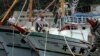 Nelayan mengikat perahu mereka di Keelung, timur laut Taiwan. Enam warga Indonesia yang merupakan awak sebuah kapal penangkap ikan di Jepang dinyatakan hilang setelah perahu berbendera Taiwan yang ditumpangi mereka terguling pada 5 Maret. (Foto: AP)