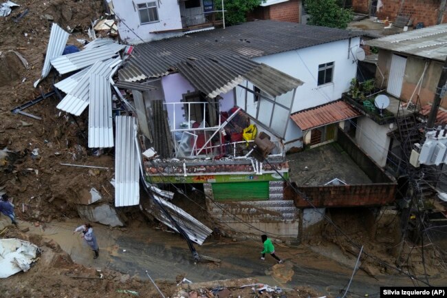 Damaged residences are seen after a landslide in Petropolis, Brazil, Wednesday, Feb. 16, 2022.