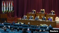 FILE - Libyan parliament meets to discuss approving new government, in Sirte, March 8, 2021.