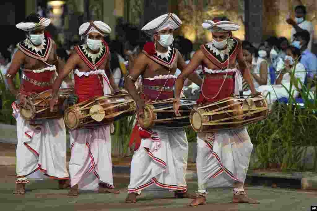 Traditional Sri Lankan drummers perform during Navam Perahera, an annual Buddhist temple festival in Colombo.