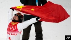 China's Xu Mengtao celebrates after winning a gold medal in the women's aerials finals at the 2022 Winter Olympics, Feb. 14, 2022, in Zhangjiakou, China.