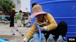 A Woman Fetching Water - Phnom Penh Water Shortage. (File)