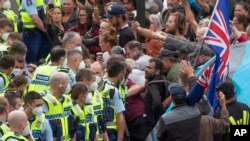 Police arrest people protesting against coronavirus mandates at Parliament in Wellington, New Zealand, Feb. 10, 2022. 