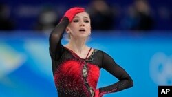 Kamila Valieva, of the Russian Olympic Committee, reacts in the women's team free skate program during the figure skating competition at the 2022 Winter Olympics, Feb. 7, 2022, in Beijing. 