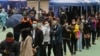 People queue to get tested for the coronavirus at a makeshift testing site in Hong Kong, Feb. 10, 2022.