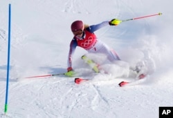 Mikaela Shiffrin, of the United States skis out in the first run of the women's slalom at the 2022 Winter Olympics, Feb. 9, 2022. (AP Photo/Robert F. Bukaty)