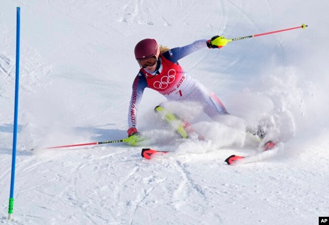 Mikaela Shiffrin, of the United States skis out in the first run of the women's slalom at the 2022 Winter Olympics, Feb. 9, 2022. (AP Photo/Robert F. Bukaty)