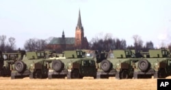 U.S. troops of the 82nd Airborne Division recently deployed to Poland because of the Russia-Ukraine tensions are setting up camp at a military airport in Mielec, southeastern Poland, Feb. 12, 2022.