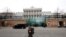 FILE - A member of Austrian armed forces walks past Palais Coburg, the site of a meeting of the Joint Comprehensive Plan of Action, in Vienna, Austria, Feb. 8, 2022. 