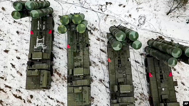 In this photo, taken from video, from the Russian Defense Ministry Press Service on Thursday, Feb. 10, 2022, combat crews of the S-400 air defense system take up duty during Russia-Belarus military drills in Belarus. (Russian Defense Ministry Press Service via AP)