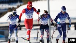 (From L) Sweden's Jonna Sundling, Russia's Natalia Nepryaeva, Norway's Maiken Caspersen Falla and Finland's Krista Parmakoski compete in the women's team sprint classic semi-finals event.