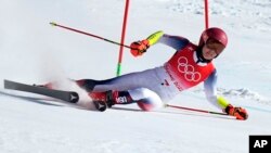 Mikaela Shiffrin of United States loses control and skis off course during the first run of the women's giant slalom at the 2022 Winter Olympics, Feb. 7, 2022.