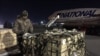 Military aid, delivered as part of the United States' security assistance to Ukraine, is unloaded from a plane at the Boryspil International Airport outside Kyiv, Ukraine Feb. 13, 2022. 