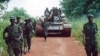 FILE - A Ugandan battalion withdraws from the northeast Bafwasende town, Democratic Republic of Congo, July 11, 2001. 