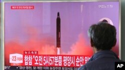 FILE - A man watches a TV screen showing a file footage of North Korea's missile launch, at the Seoul Railway Station in Seoul, South Korea, Aug. 29, 2017. 