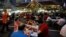 People eat at Lau Pa Sat food center in Singapore, July 29, 2016.