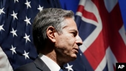 US Secretary of State Antony Blinken listens as he is introduced to speak at a mission Australia meet and greet in Melbourne, Australia, Feb. 10, 2022.