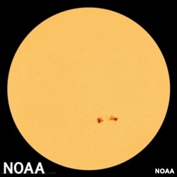 FILE - Sunspots are observed on the sun, Aug. 24, 2015. (NASA photo courtesy of NOAA)