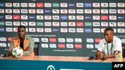 Ivory Coast's coach Emerse Fae and forward Max-Alain Gradel attend a press conference at the Palais de la Culture in Abidjan on February 6, 2024, on the eve of the 2023 Africa Cup of Nations semi-final against DRC. 