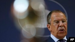 Russian Foreign Minister Sergey Lavrov addresses the media after talks with his Serbian counterpart Ivica Dacic in Belgrade, Serbia, June 17, 2014. 