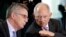 German Interior Minister Thomas de Maiziere, left, and German Finance Minister Wolfgang Schaeuble, right, talk prior to the weekly cabinet meeting at the chancellery in Berlin, Germany, Wednesday, April 5, 2017. 
