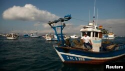 A Spanish fisherman in his boat takes part in a protest at the site of an artificial reef near Gibraltar August 18, 2013.