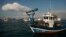 A Spanish fisherman in his boat takes part in a protest at the site of an artificial reef near Gibraltar August 18, 2013.