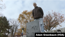 Mark Lindenberg visits the grave of his pet cat, Boots, who is buried at the Hartsdale Pet Cemetery, located about 30 kilometers outside of New York City.