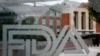 FILE - A U.S. Food and Drug Administration building is seen behind FDA logos at a bus stop on the agency's campus in Silver Spring, Maryland, on Aug. 2, 2018. The FDA announced on Nov. 28, 2024, a recall on cucumbers.