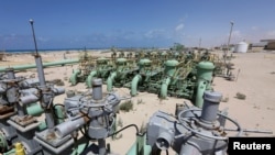 FILE - A general view of pipelines at the Zueitina oil terminal, in Zueitina, west of Benghazi, Libya, April 7, 2014.
