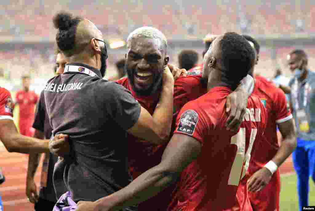 Equatorial Guinea's Esteban Obiang celebrates with teammates after the match against Algeria; Cameroon, Jan 16, 2022.
