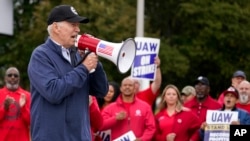 U.S. President Joe Biden joins striking United Auto Workers on the picket line, in Van Buren Township, Michigan on Sept. 26, 2023. (AP Photo/Evan Vucci)