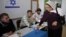 A Druze woman casts her ballot for the parliamentary election at a polling station in the northern Druze-Arab village of Maghar, Israel, January 22, 2013.
