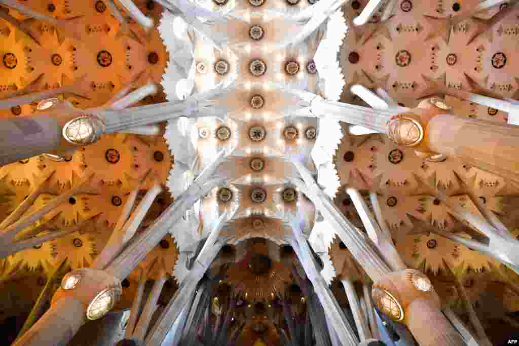A close shot of the ceiling of the Sagrada Familia in Barcelona, Spain. The long-awaited completion of Sagrada Familia will no longer happen in 2026 because of the coronavirus pandemic and funding, basilica officials said.