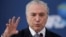 Brazil's President Michel Temer gestures during the launch of the new financing line of Bank Caixa Economica Federal in Brasilia, Nov. 24, 2016. On Dec. 1, 2016, with many governors struggling to pay pensioners and employees, Temer was forced to soften his austerity measures. 