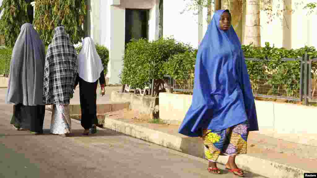 Women walk in a street in a residential area in Maiduguri, Borno State May 19, 2013.