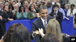 President Barack Obama shakes hands after speaking to CIA employees and thanking them for the years of effort that led to the discovery and killing of terrorist Osama bin Laden, at CIA headquarters in Langley, Va., May 20, 2011