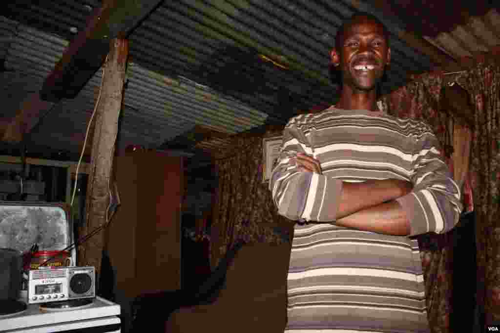 Job Mohalalelwa stands in his small shack in Munsieville west of Johannesburg. He says he was &ldquo;resurrected from the dead.&rdquo; (Photo by Darren Taylor)