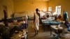 FILE - A man walks in a ward inside a hospital in Juba, South Sudan, Dec. 28, 2013.