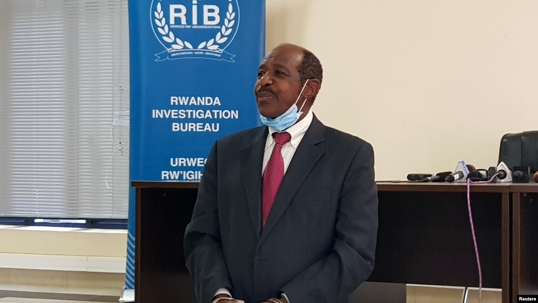 FILE - Paul Rusesabagina, the man who was hailed a hero in a Hollywood movie about Rwanda's 1994 genocide is paraded in handcuffs in front of media at the headquarters of Rwanda's Investigation Bureau, in Kigali, Aug. 31, 2020.