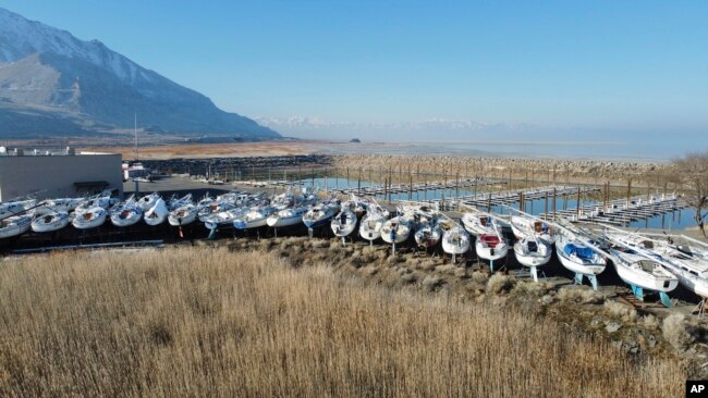 Sailboats sit in dry dock at the Great Salt Lake Marina Saturday Jan. 29, 2022, near Salt Lake City. (AP Photo/Rick Bowmer)