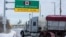A commercial truck enters the entrance ramp to the Ambassador Bridge to Canada in Detroit, Michigan, Feb. 14, 2022.