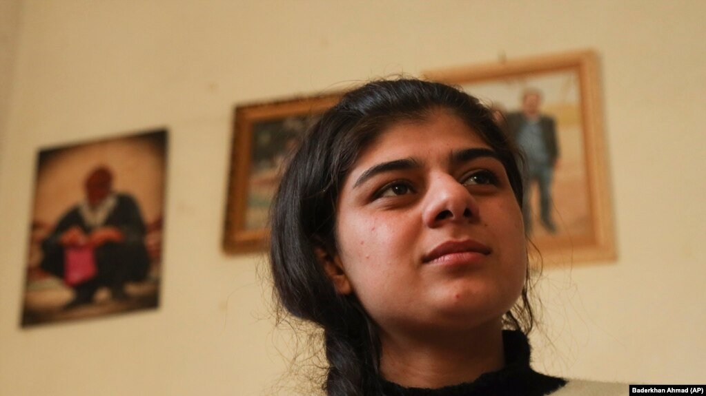 Roza Barakat poses for a portrait in a safe house in Hassakeh, Syria, Sunday, Feb. 6, 2022. 