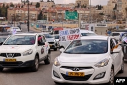 Israeli vehicles take part in a Canada-style protest convoy against COVID regulations, in Jerusalem, Feb. 14, 2022.