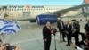 Israeli Prime Minister Naftali Bennett speaks to reporters on the tarmac at Ben Gurion Airport in Lod before departing for an official visit to Bahrain, Feb. 14, 2022. 