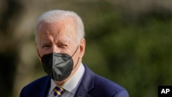 President Joe Biden walks on the South Lawn of the White House after stepping off Marine One, Feb. 10, 2022, in Washington.