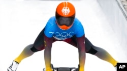 Tina Hermann of Germany finishes the women's skeleton run 3 at the 2022 Winter Olympics in Beijing, Feb. 12, 2022.