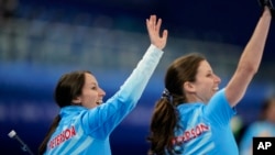 The United State's Tabitha Peterson waves to the crowd after a win against Russian Olympic Committee during a women's curling match at the Beijing Winter Olympics, Feb. 10, 2022, in Beijing. 