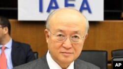 Director General of the International Atomic Energy Agency, IAEA, Yukiya Amano of Japan waits for the start of the IAEA board of governors meeting at the International Center in Vienna, Austria, March 3, 2014.