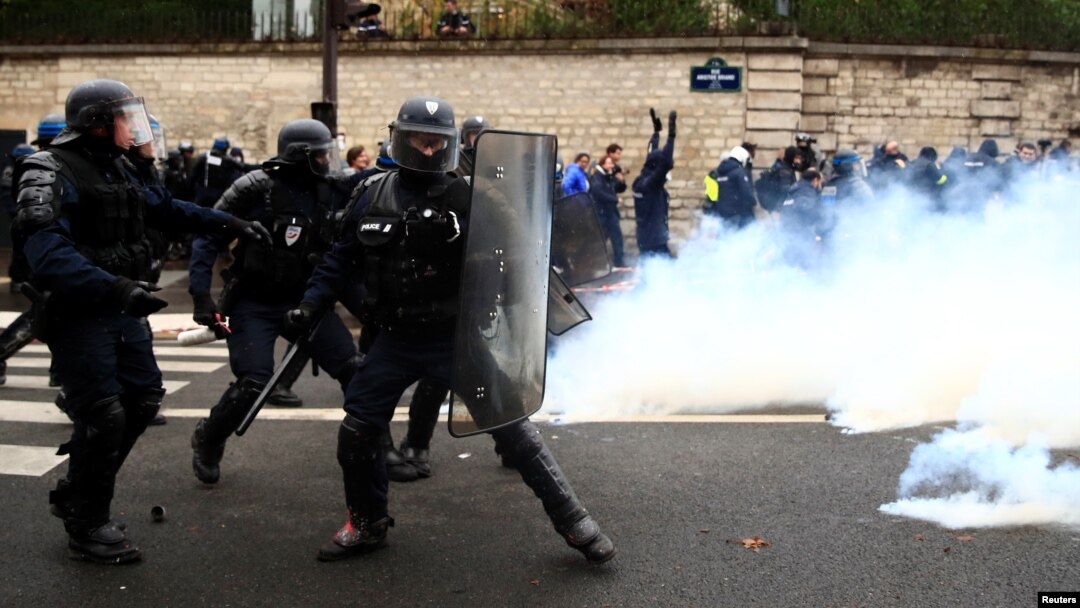 French riot police take position during clashes with French ambulance drivers as part of a demonstration at the Place de la Concorde in Paris, France, Dec. 3, 2018.